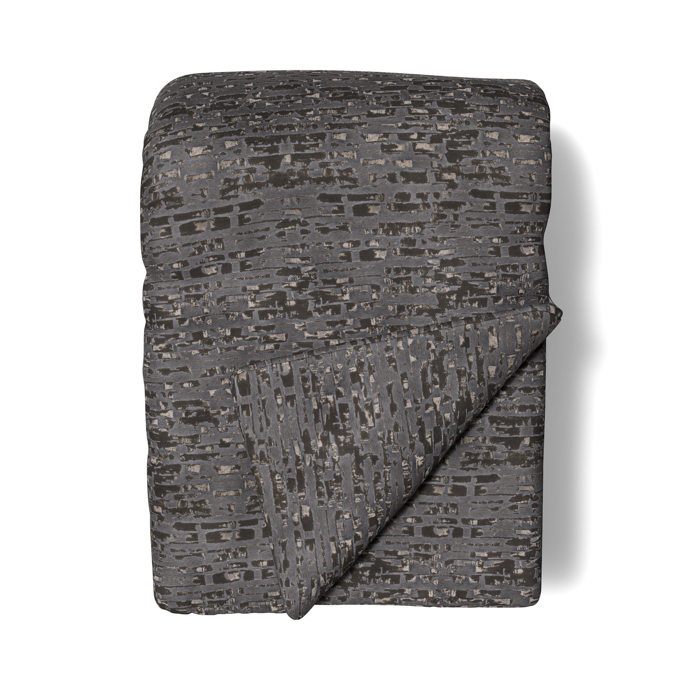 Folded Ann Gish Delphi throw in charcoal with abstract mosaic pattern, corner turned back.
