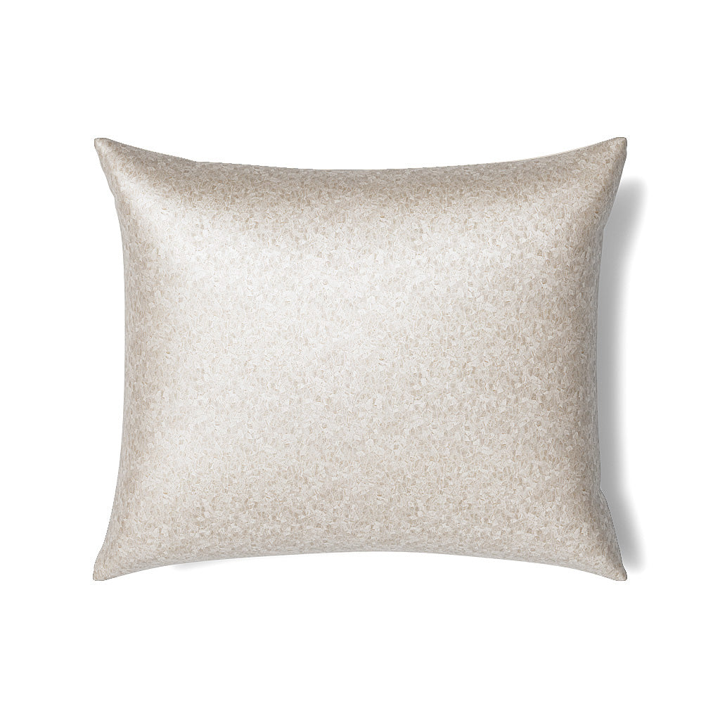 Ivory pillow with shimmering speckled metallic texture, photographed flat on white background.