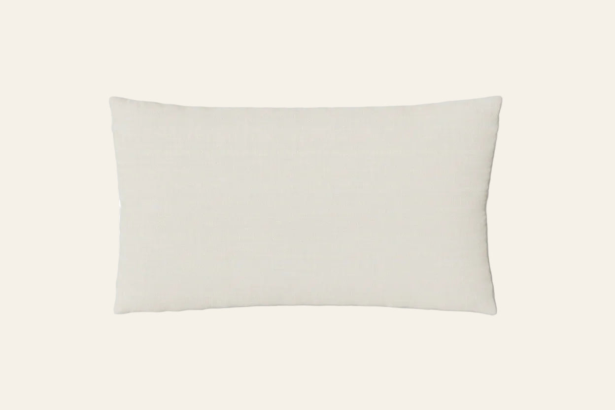Ann Gish Doria pillow in ivory, rectangular silhouette on neutral background.