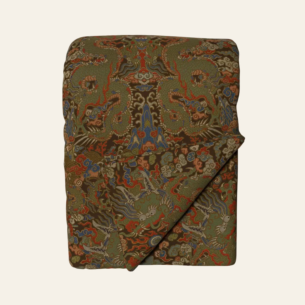 Ann Gish Dragon throw in olive green with ornate multicolor dragon jacquard pattern.