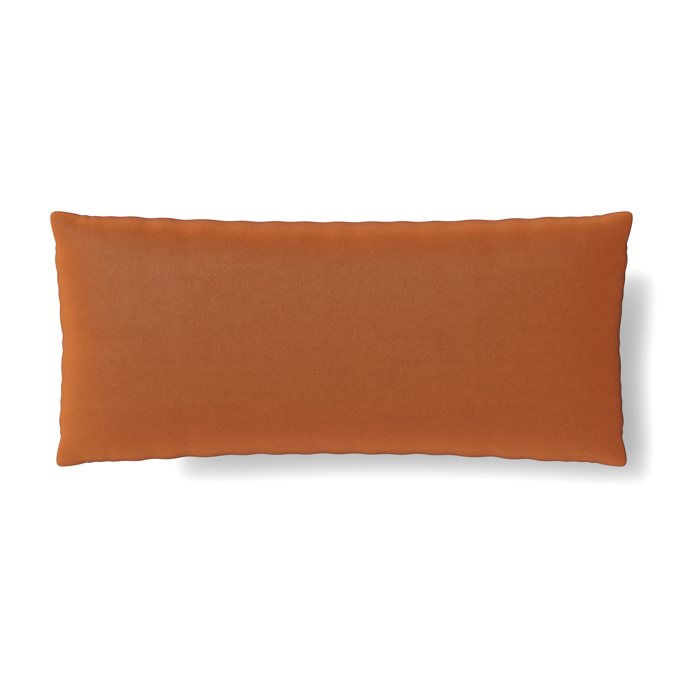 Rust-colored lumbar pillow shown from front, plush velvet surface against white background.