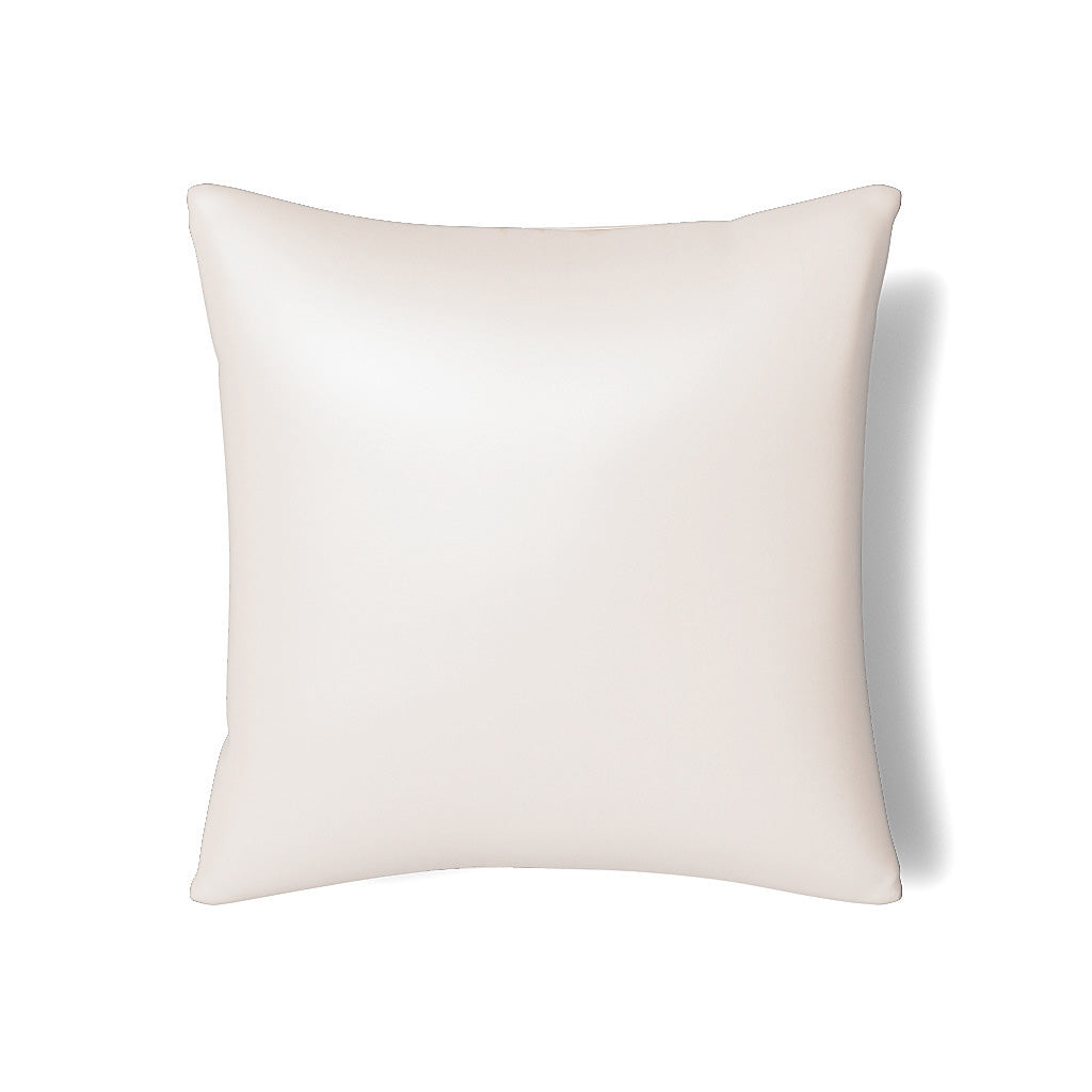 Close-up of Ann Gish Duchess pillow in ivory with subtle satin sheen finish.