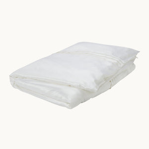 Photo of the Eva White Silk Duvet Cover ensemble.
