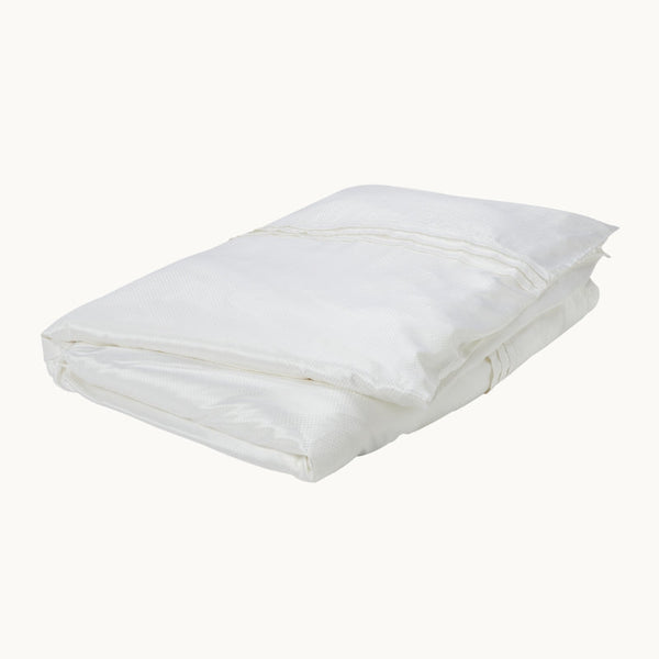 Photo of the Eva White Silk Duvet Cover ensemble.