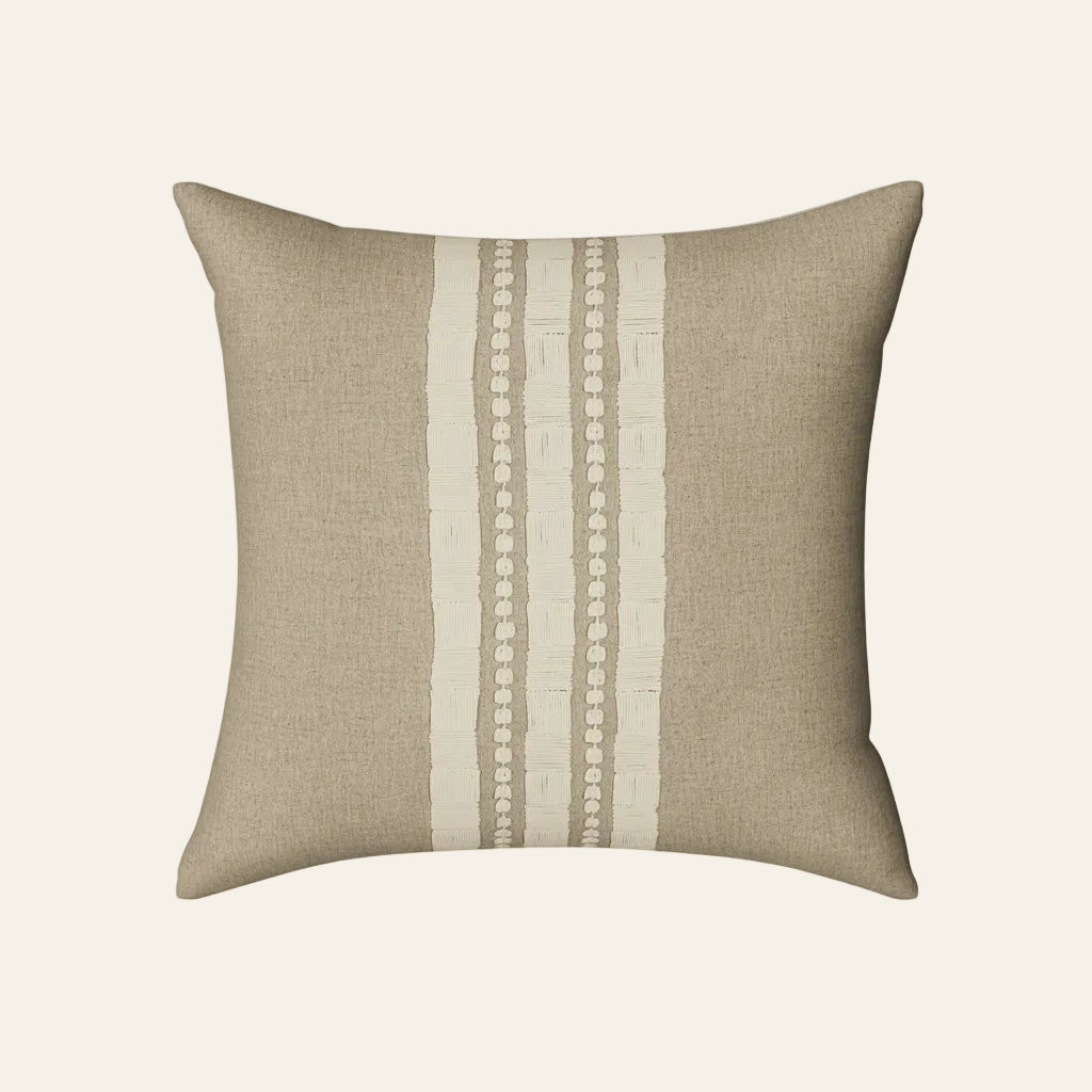 Ann Gish Echelon pillow in natural linen with ivory vertical stripes and dotted trim detail.