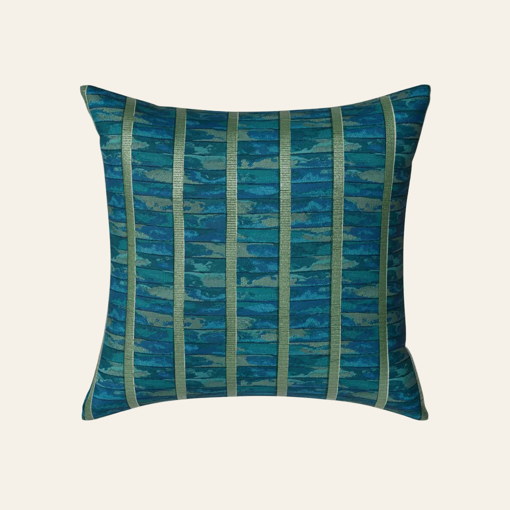 Ann Gish Egyptian Faience pillow in teal with gold vertical stripe jacquard pattern.