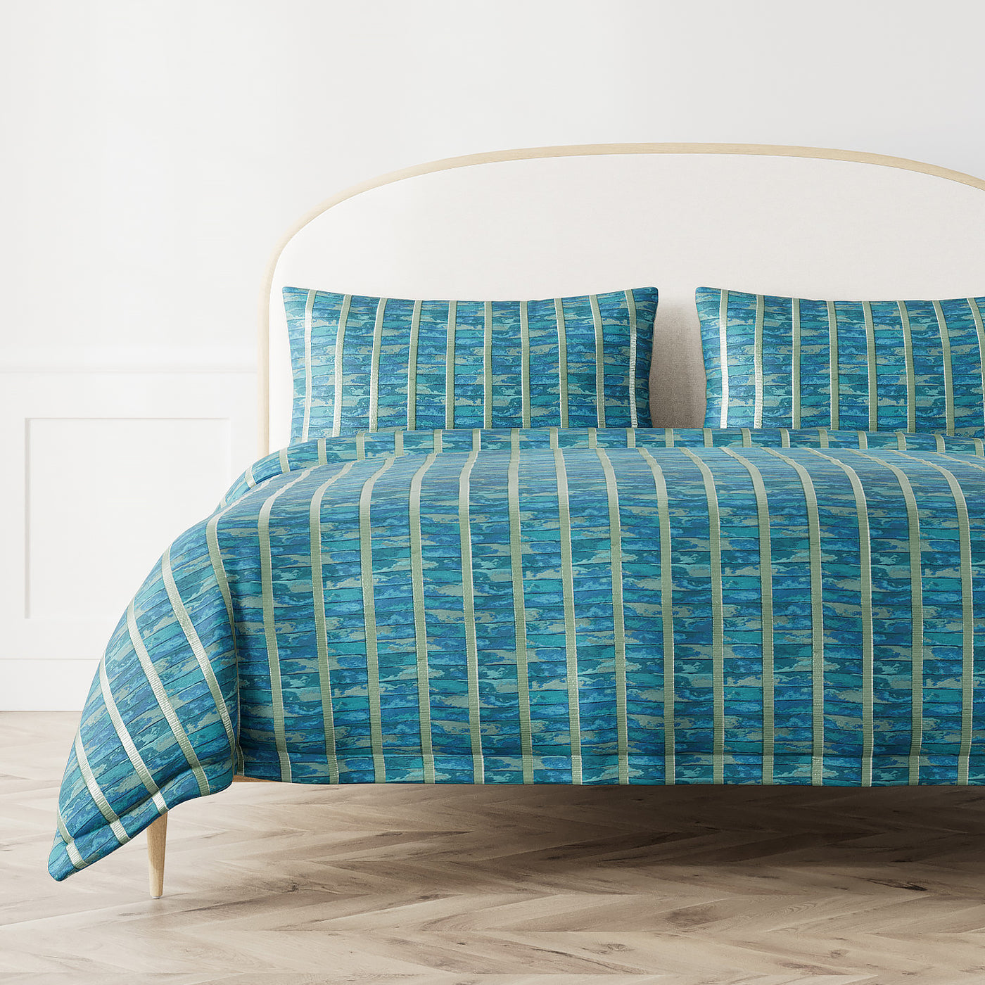 Ann Gish Egyptian Faience duvet cover in teal with lime green vertical stripe pattern on styled bed.