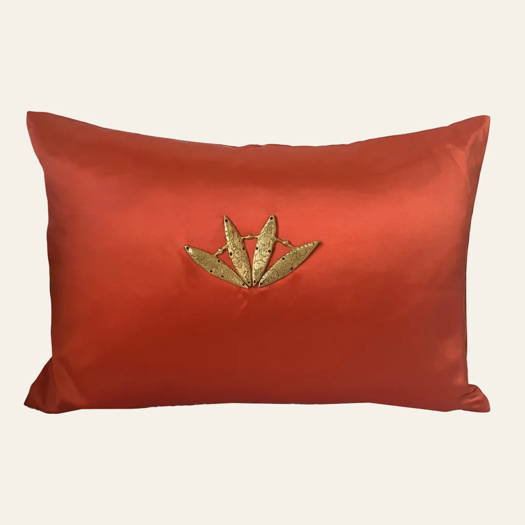 Ann Gish Minoan pillow in terracotta silk with gold leaf embellishment.
