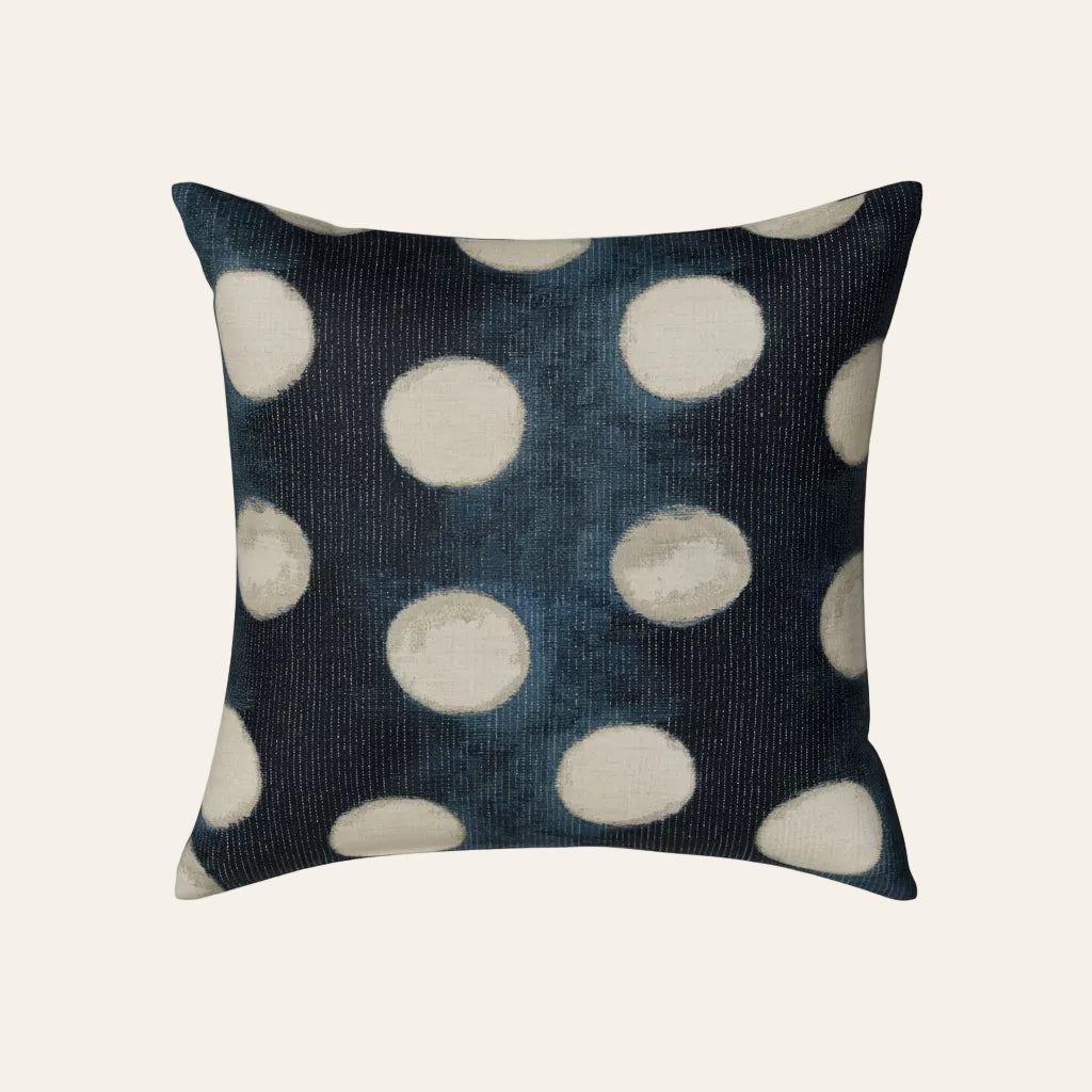 Ann Gish Eclipse pillow in navy with ivory shibori-style dot pattern.