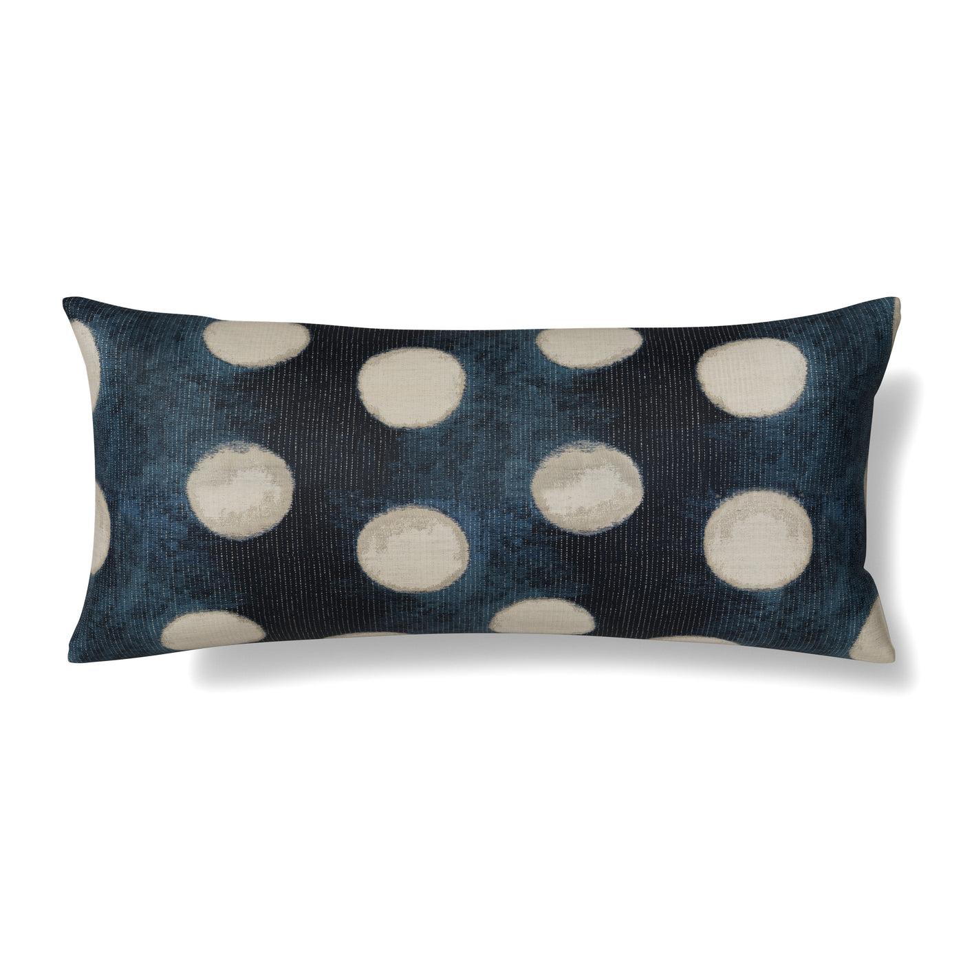 Ann Gish Eclipse lumbar pillow in indigo with ivory velvet polka dots, angled view.