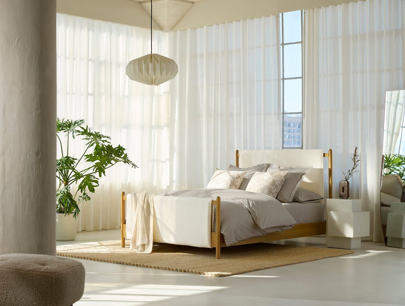 Coyuchi Refined Percale duvet cover styled on bed in bright, airy room with natural light.