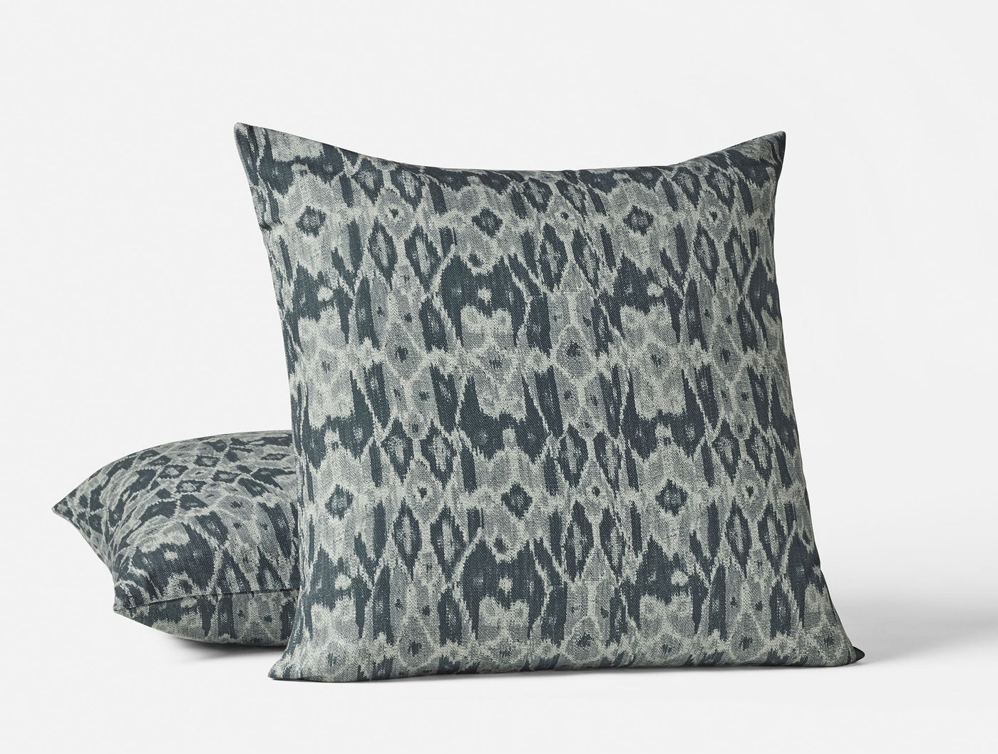 Coyuchi Cavallo Print decorative pillow in slate blue ikat pattern, two sizes shown.