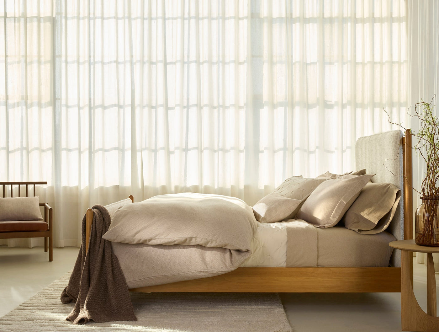 Coyuchi Cloud Brushed Flannel duvet cover styled on bed in warm natural bedroom setting.
