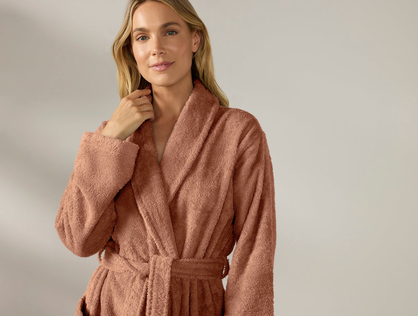 Close-up of Coyuchi Cloud Loom robe in dusty rose, showing plush terry texture and shawl collar.