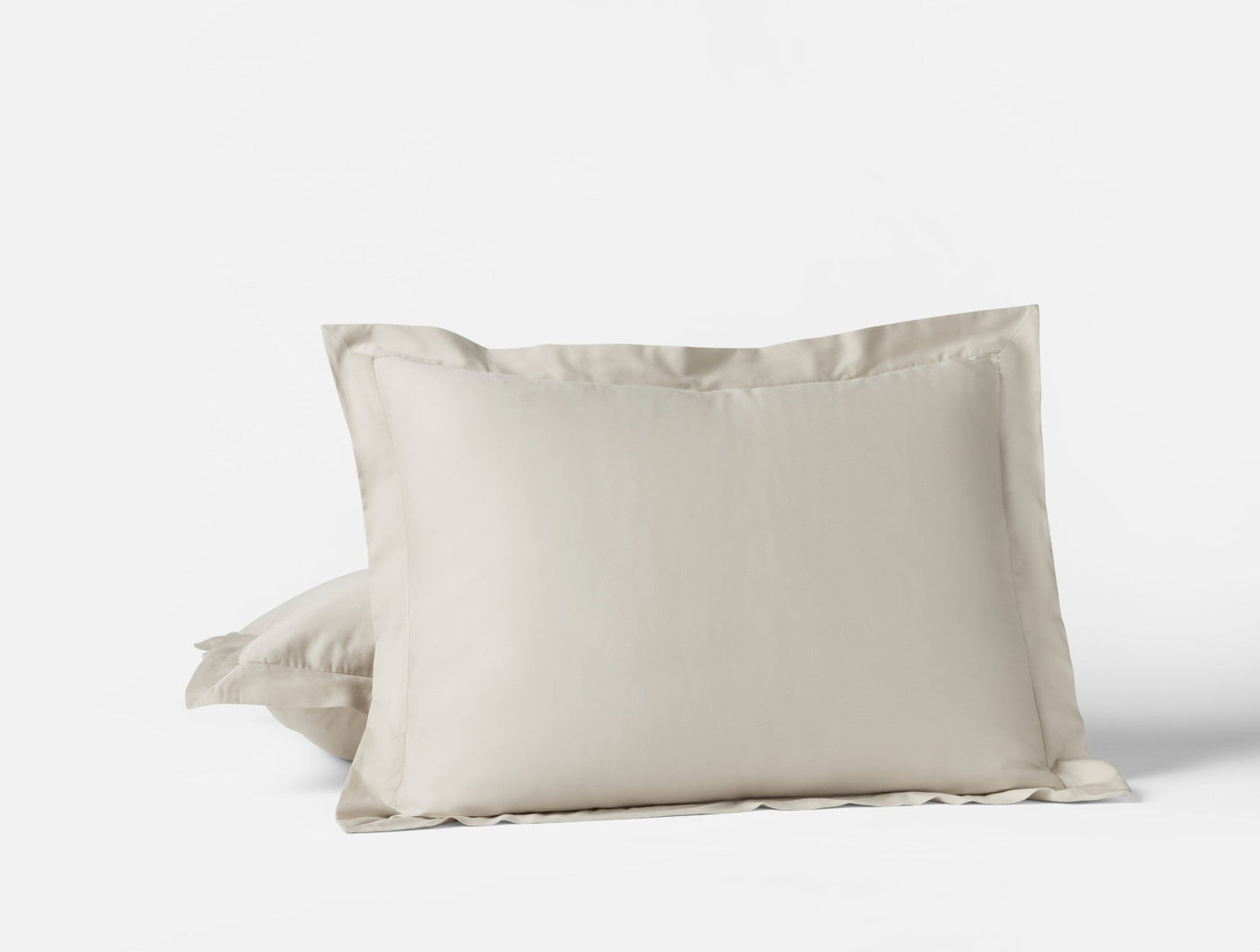 Ivory sateen pillow sham with wide flange border, front and back view.