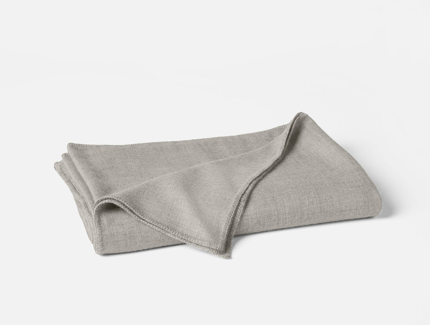Folded silver grey baby alpaca blanket with ribbed edges, shown on white background.