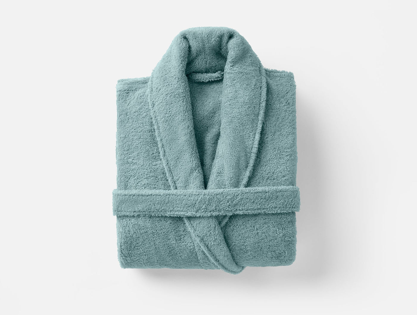 Coyuchi Cloud Loom robe folded flat, mineral blue terry cloth with shawl collar.