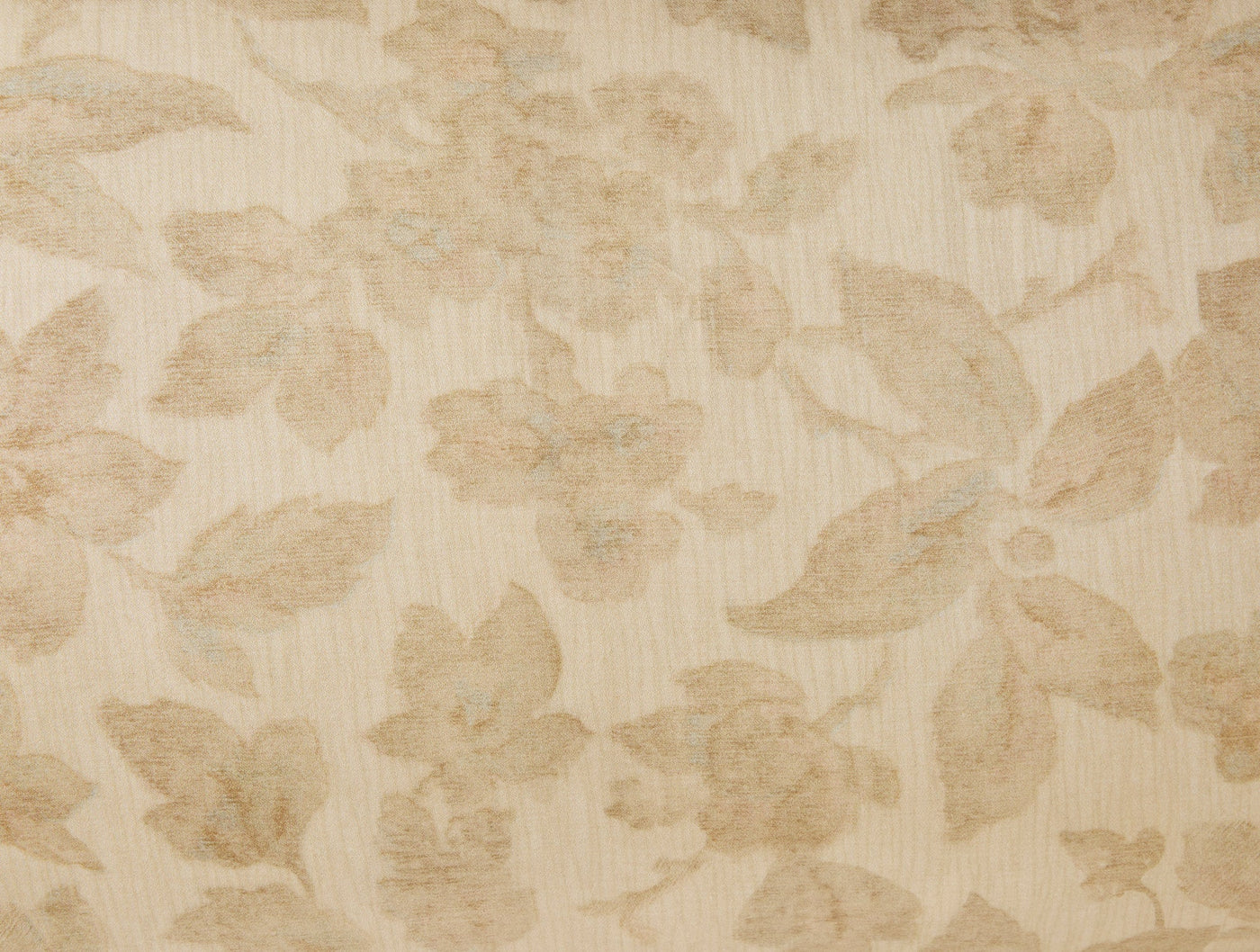 Close-up of Coyuchi Camellia Print sham in champagne, showing tone-on-tone floral jacquard weave.
