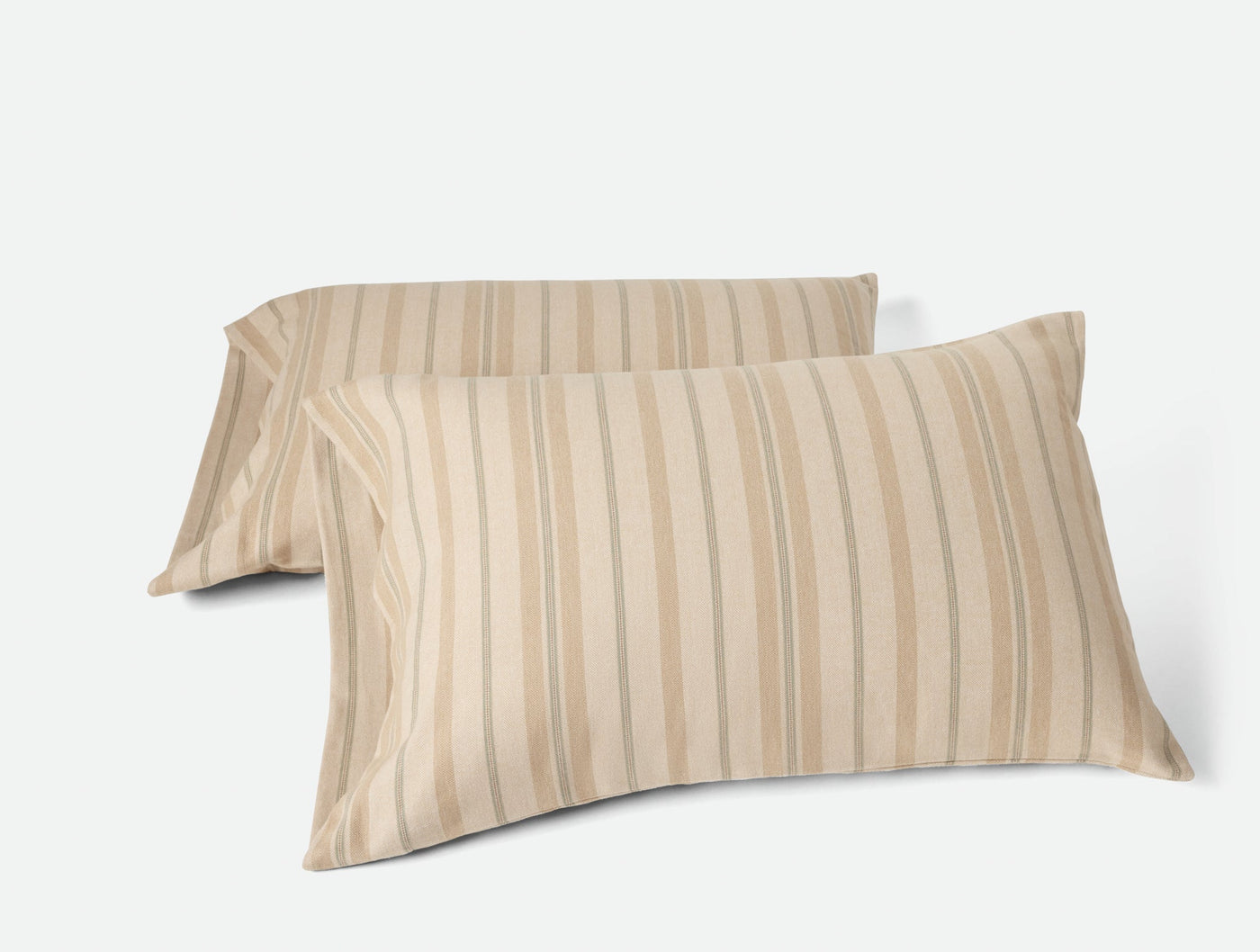 Two sand-toned striped flannel pillowcases layered at an angle on white background.