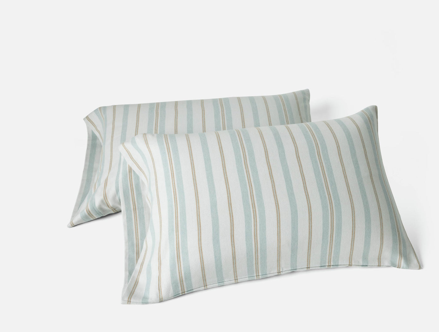 Pair of Coyuchi Cloud Brushed Flannel pillowcases in seafoam and sand stripe pattern.