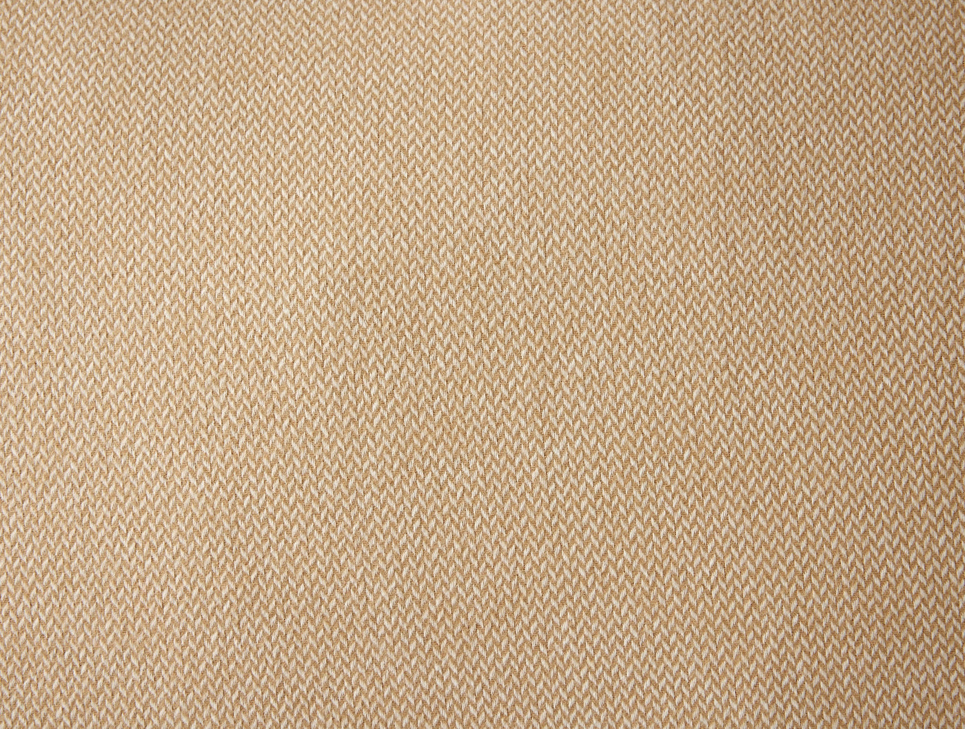 Close-up of Coyuchi Cloud Brushed Flannel sham in warm wheat herringbone weave texture.