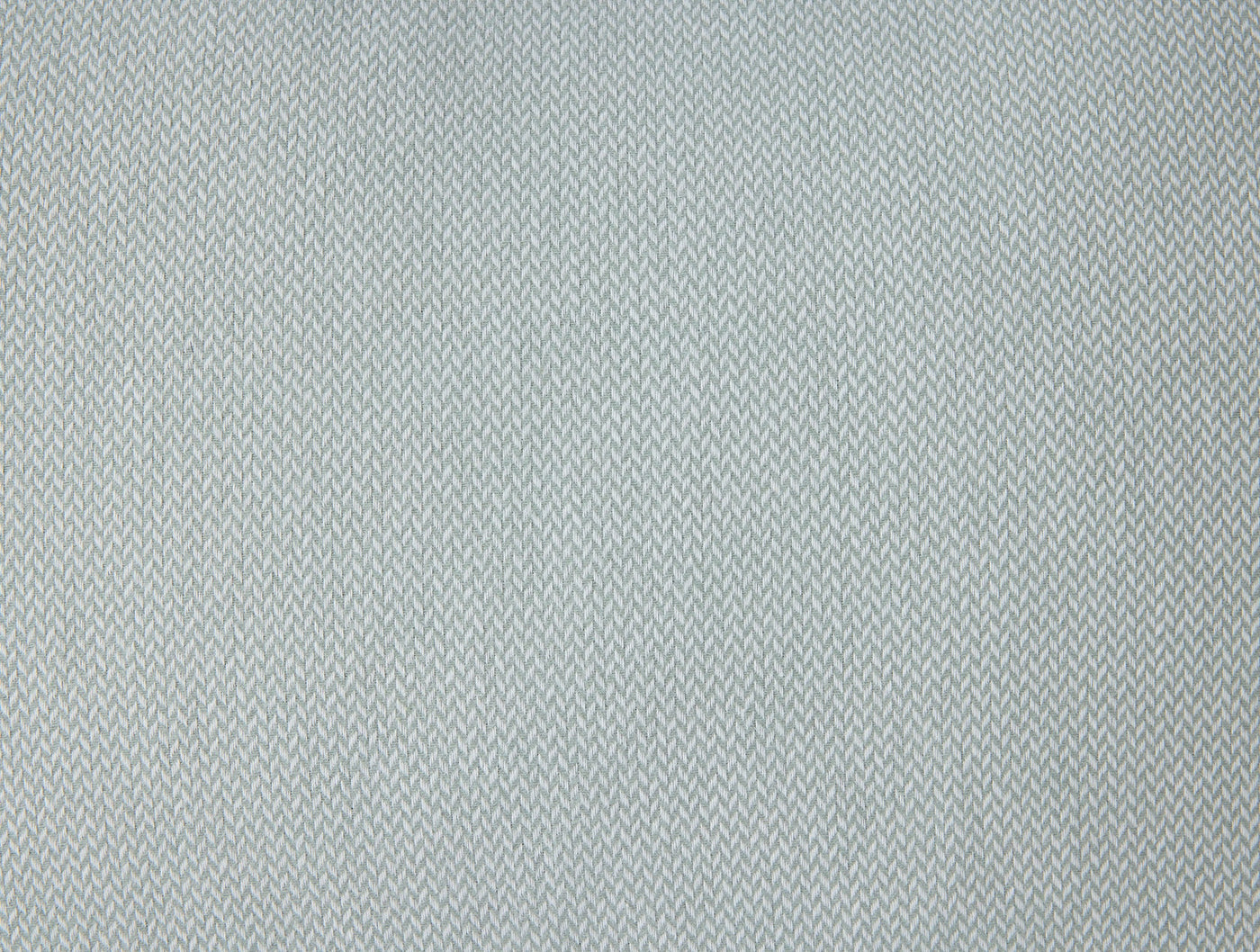 Close-up of Coyuchi Cloud Brushed Flannel sham in mist blue herringbone weave texture.