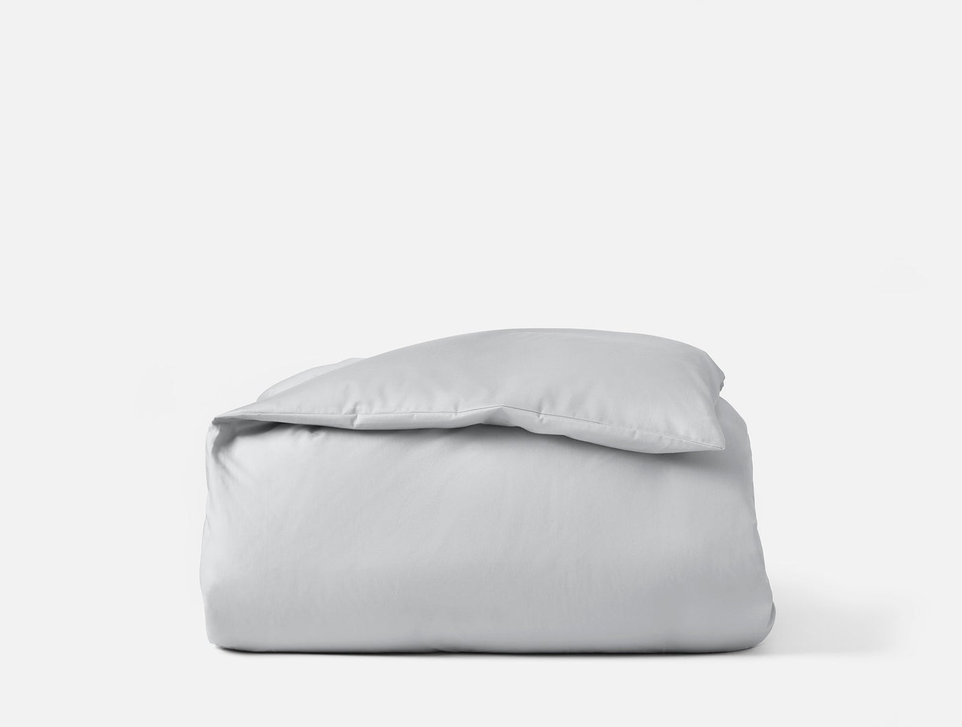 Coyuchi Cloud Soft Sateen duvet cover folded neatly, shown in silver-grey.