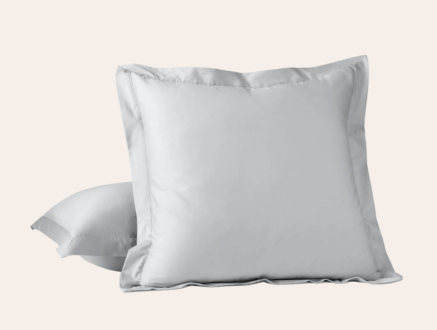 Coyuchi Cloud Soft Sateen sham in white, flange edge detail, two shams styled upright.