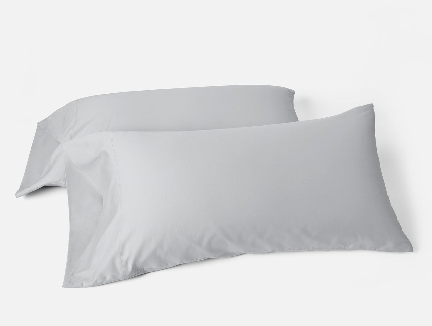 Two Coyuchi Cloud Soft Sateen pillowcases in silver, smooth finish, shown as a pair.