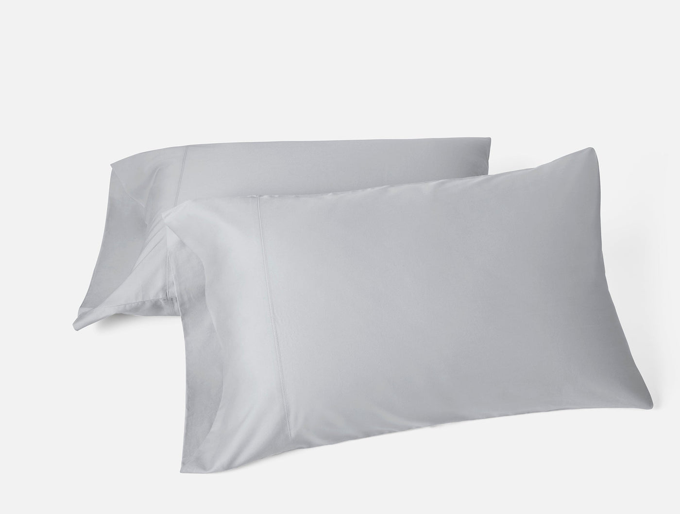 Two Coyuchi Cloud Soft Sateen pillowcases in silver, smooth finish, stacked pair view.