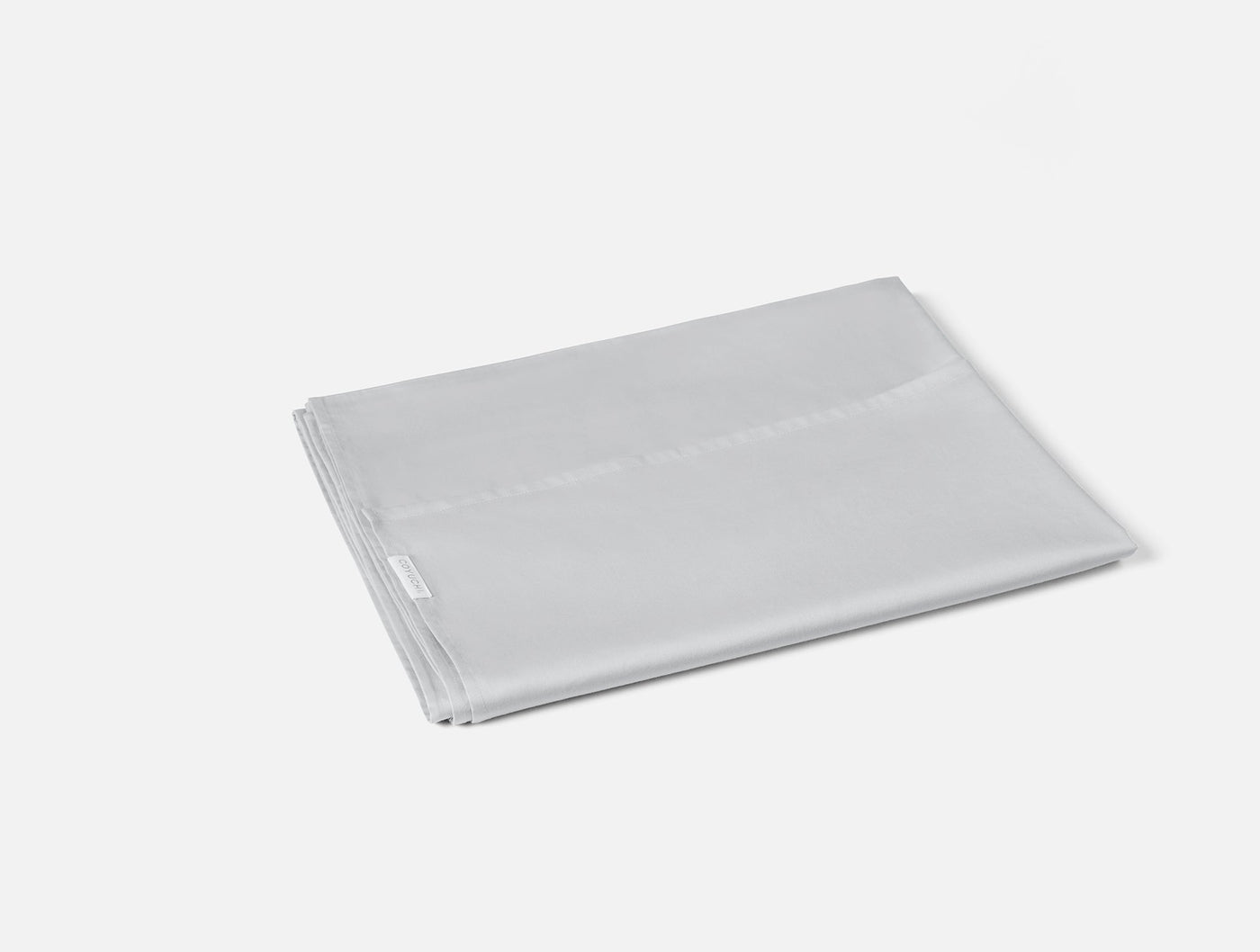 Coyuchi Cloud Soft Sateen travel sack folded flat, silver grey, subtle sheen visible.