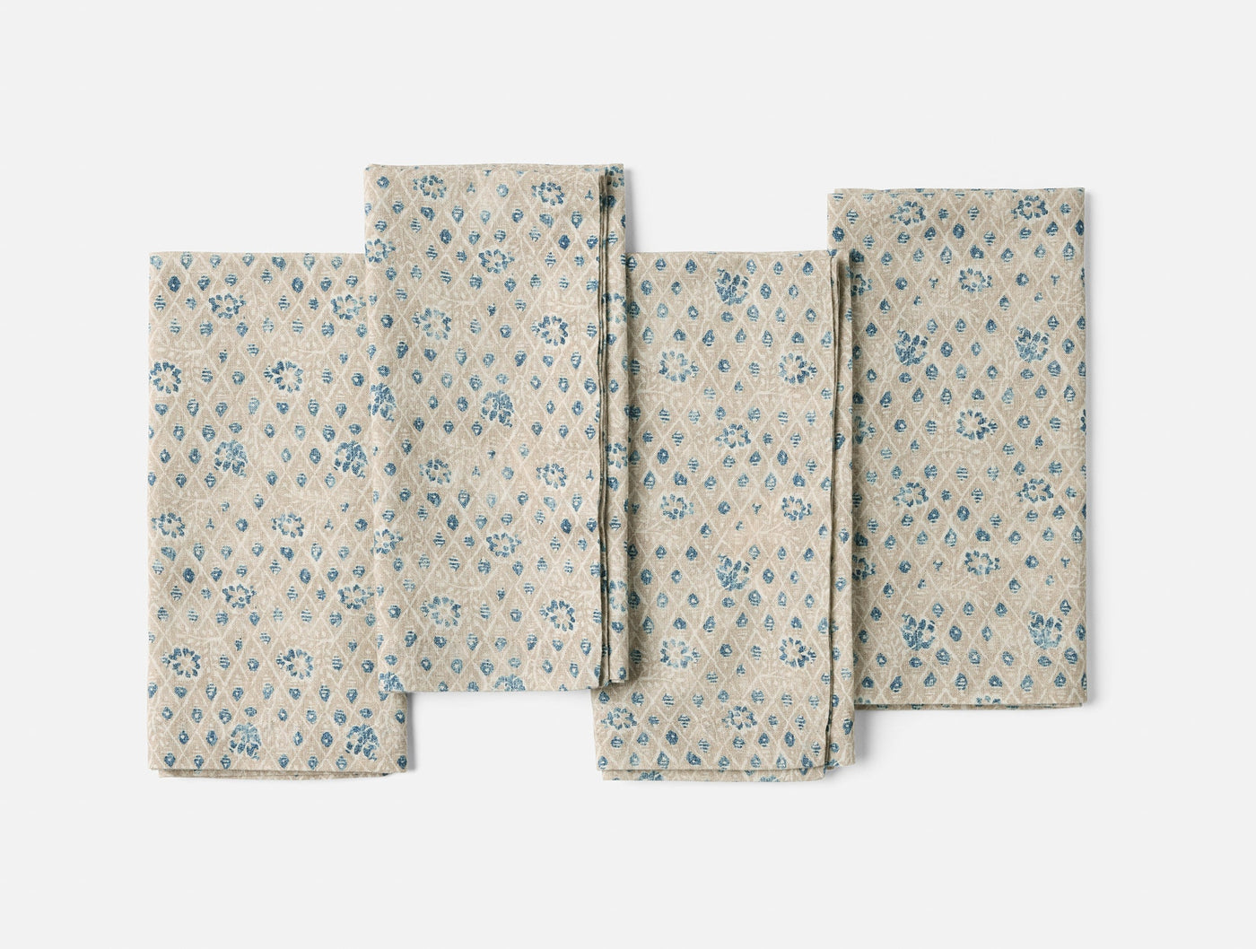 Coyuchi Coral Bell Print napkin set, natural linen with blue floral diamond block print.