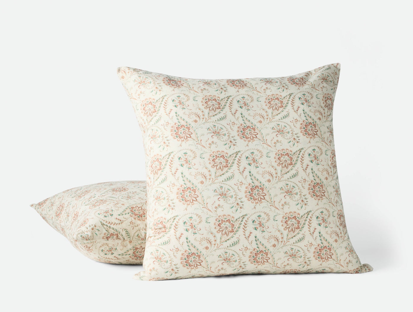 Coyuchi Ponderosa Print pillow covers in ivory with terracotta and sage floral block print pattern.