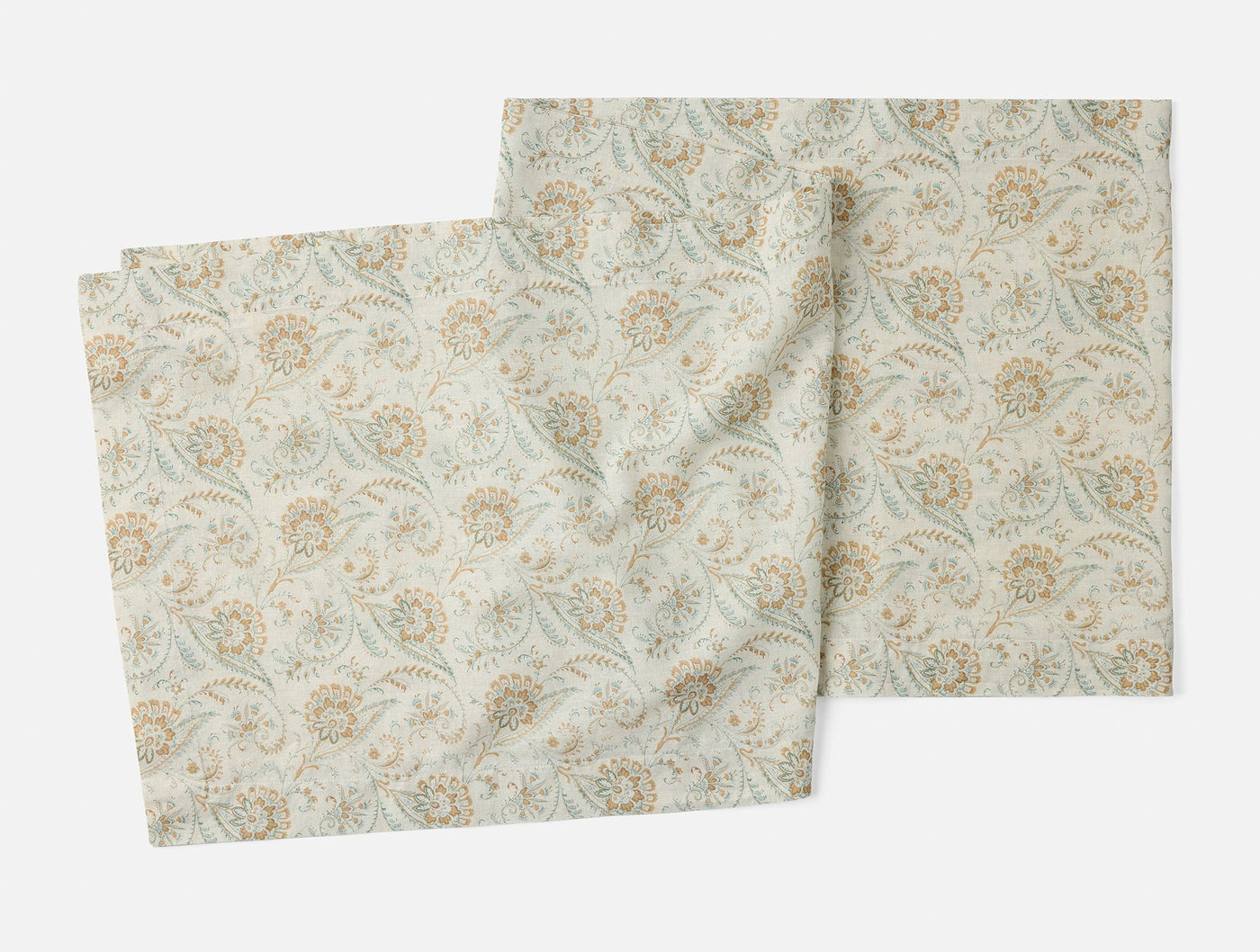 Coyuchi Ponderosa Print table runner, ivory with sage and ochre floral paisley pattern, set of two.