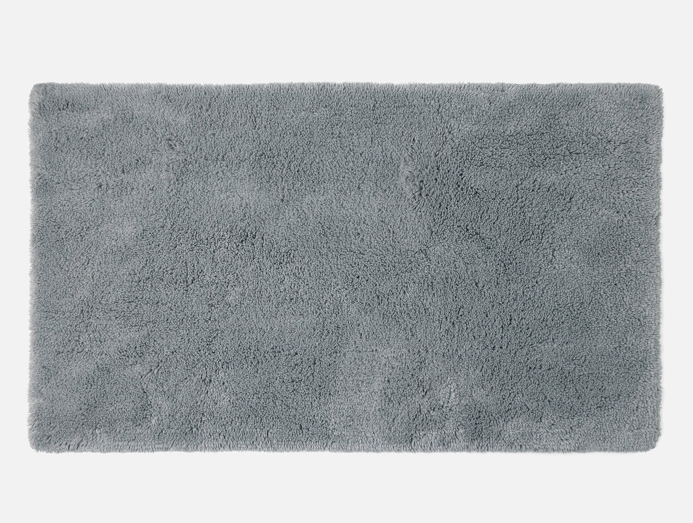 Coyuchi Shag bath rug in slate, overhead view showing plush looped pile texture.