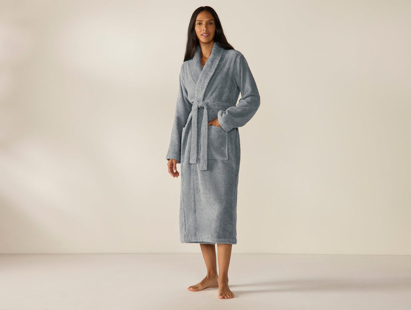 Coyuchi Cloud Loom robe in slate blue, full-length view on standing model, belted front.