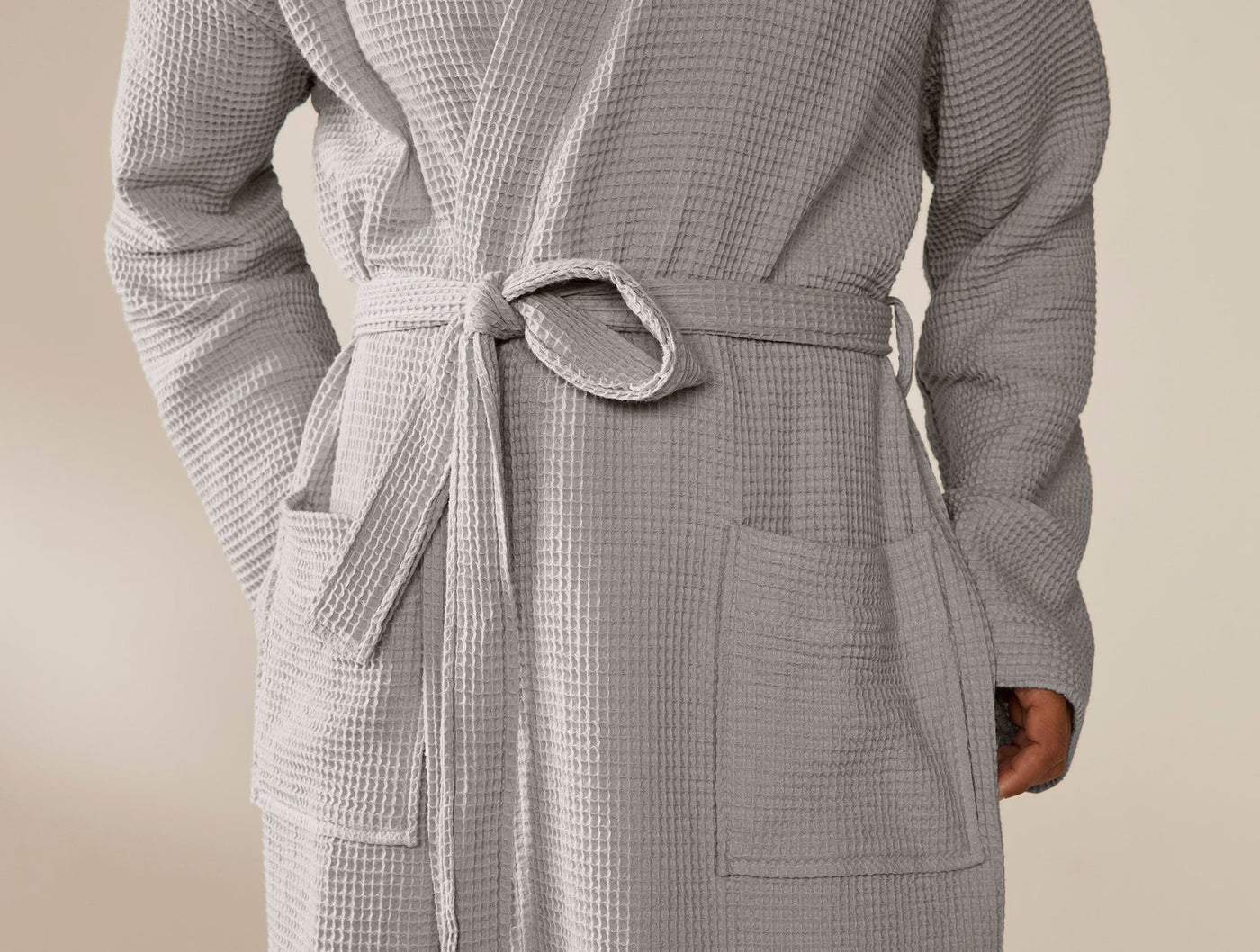 Close-up of Coyuchi Unisex Waffle Robe belt and patch pockets in silver grey waffle texture.