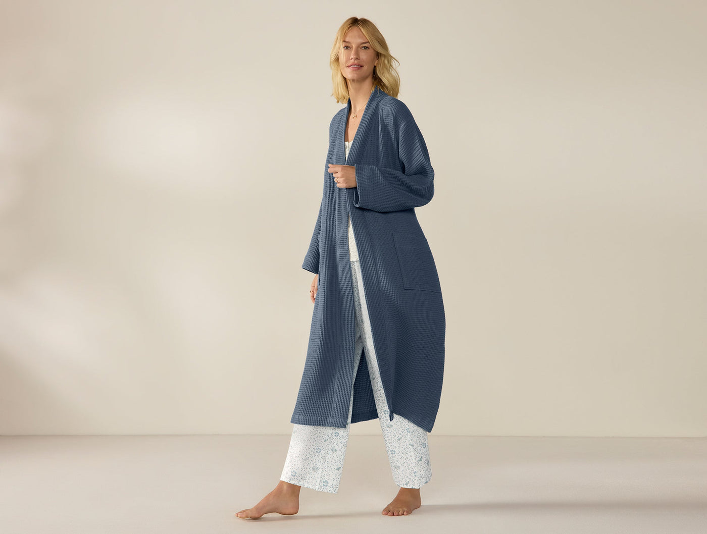 Coyuchi Unisex Waffle Robe in slate blue, full-length front view on walking model.