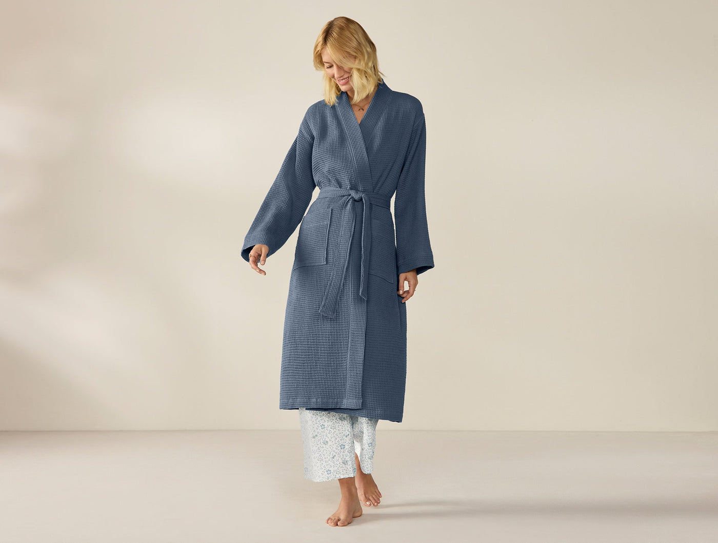 Coyuchi Unisex Waffle Robe in slate blue, full-length view on standing model.