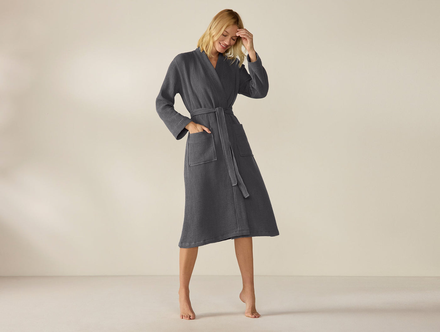 Coyuchi Unisex Waffle Robe in slate, full-length view on model, belted midi length.