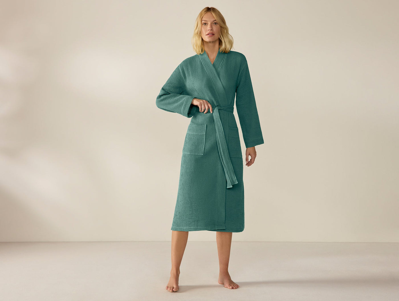Coyuchi Unisex Waffle Robe in teal, full-length front view on model.