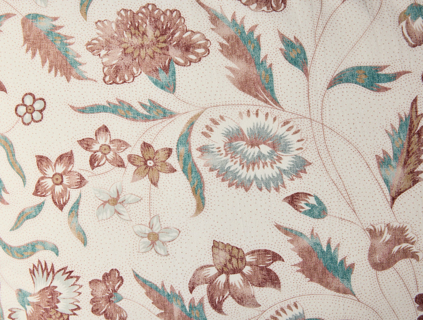 Close-up of Coyuchi Viola Print sham fabric, mauve and teal floral motifs on ivory ground.