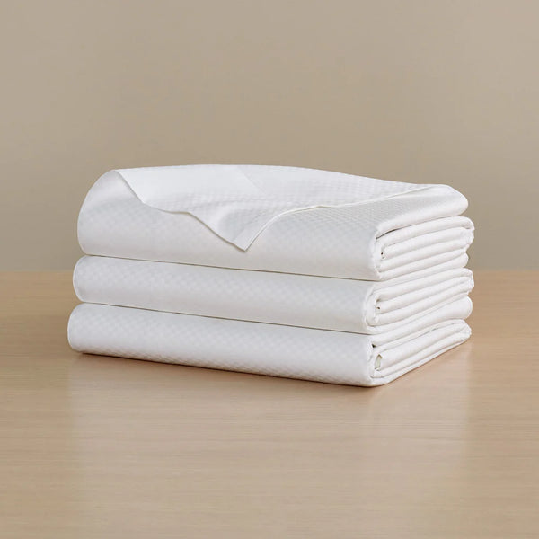 Photo of the Checkered Sateen | Flat Sheet ensemble.