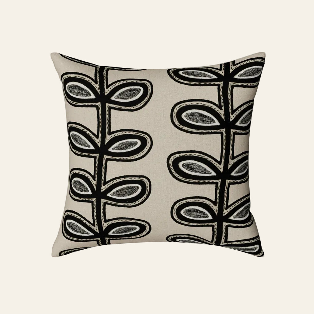 Ann Gish Fellini pillow in ivory with bold black embroidered botanical stem pattern.