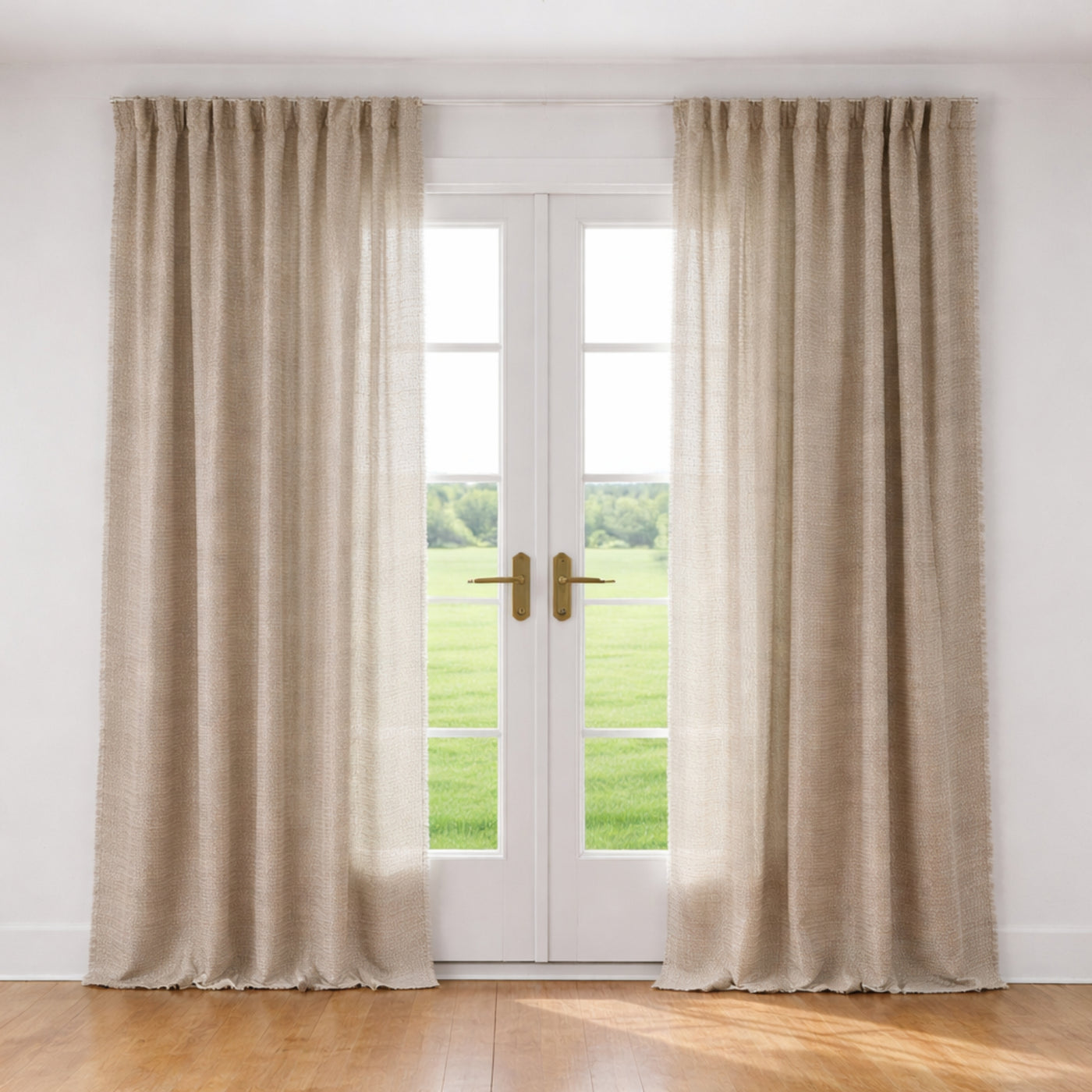Ann Gish Ficelle curtain panels in natural linen flanking white French doors, full-length drape.
