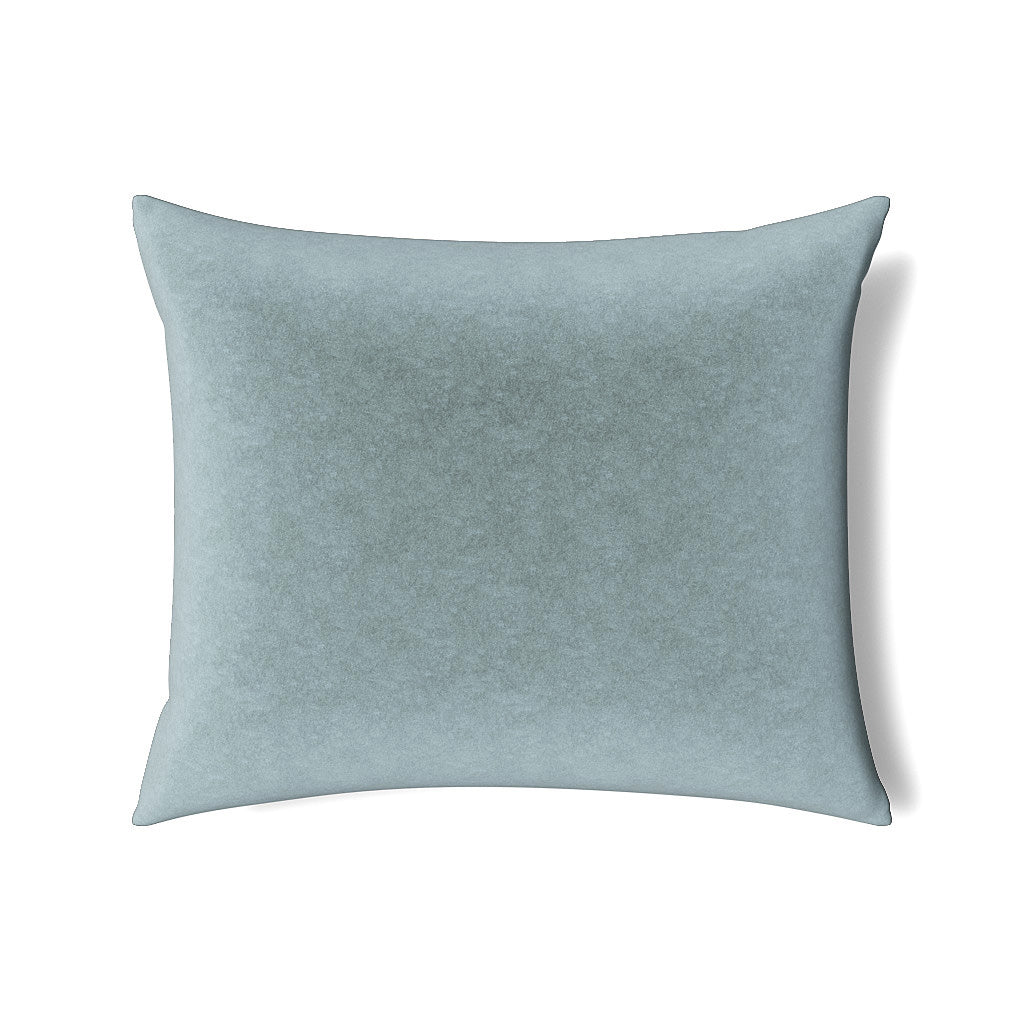 Close-up of Ann Gish Fresco Velvet pillow in muted sky blue with subtle mottled texture.