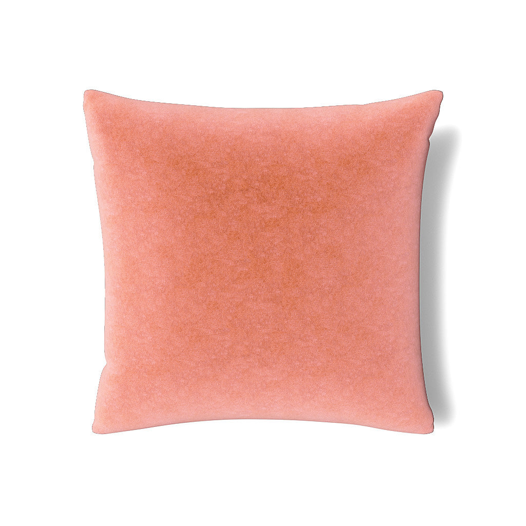 Close-up of Ann Gish Fresco Velvet sham in coral, showing soft mottled velvet texture.