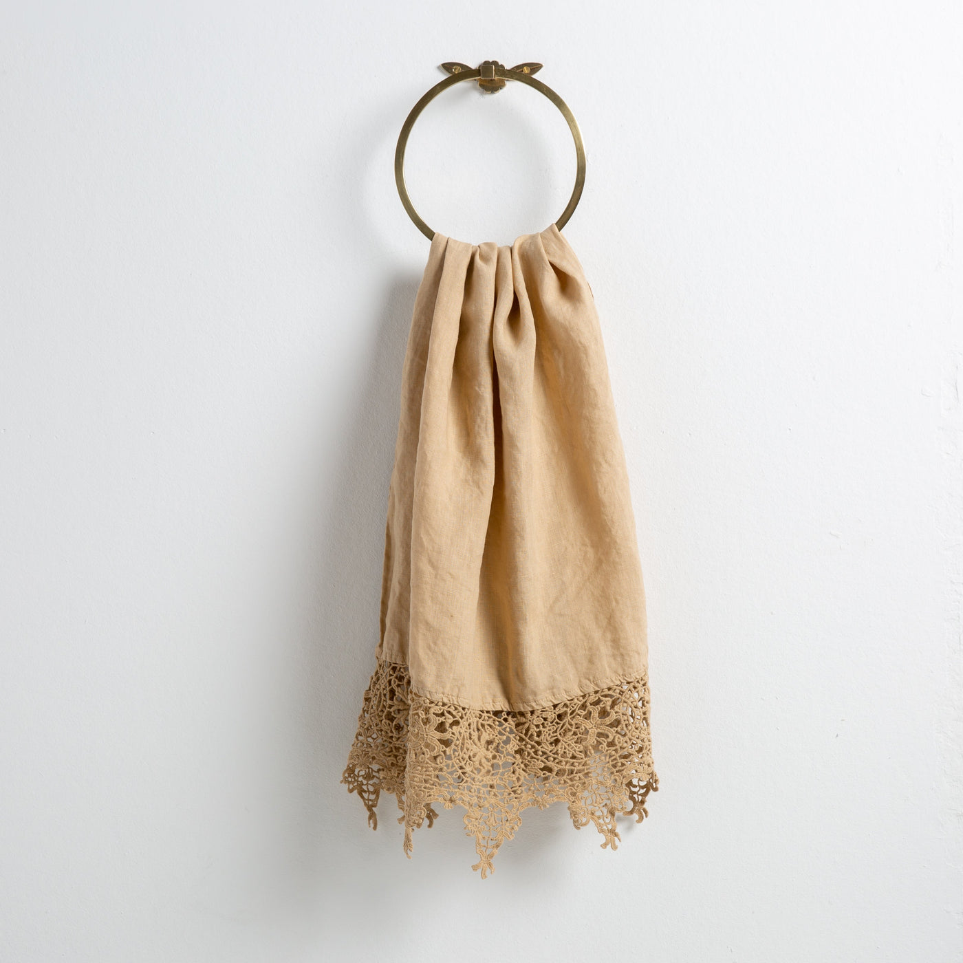 Bella Notte Frida guest towel in Honeycomb, draped on brass ring showing crochet lace hem.