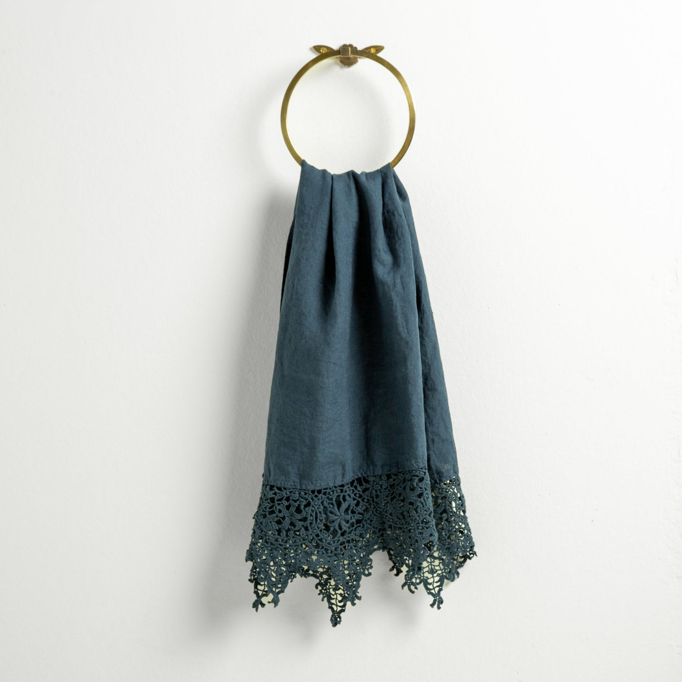Midnight Bella Notte Frida guest towel close-up showing deep teal linen with intricate crochet lace hem.