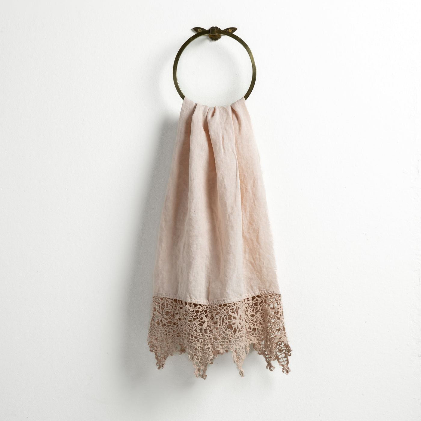 Bella Notte Frida guest towel in Pearl, draped on brass ring, crochet lace hem detail.